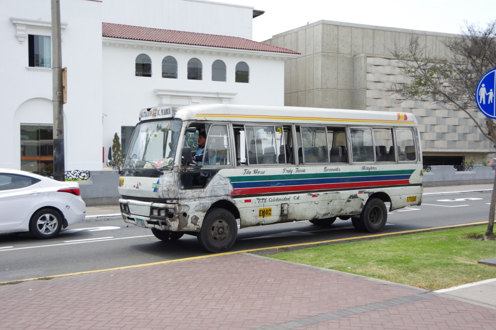 Crappy-looking local buses are common even in rich neighborhoods
