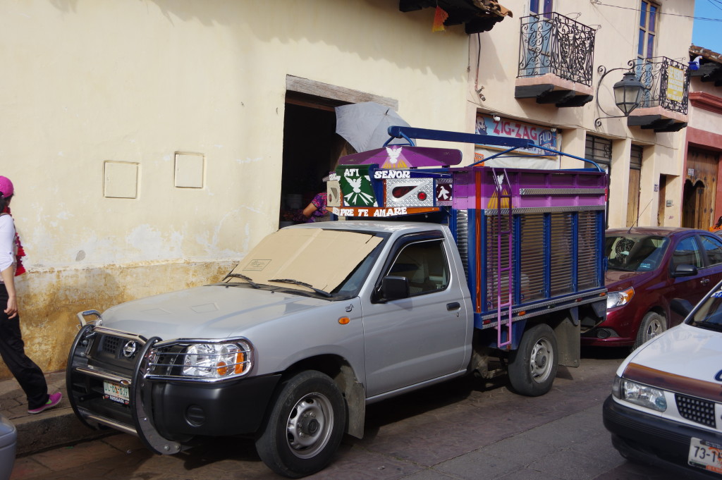 Pickup truck ornated with dubious religious symbols (most trucks in the area have them)