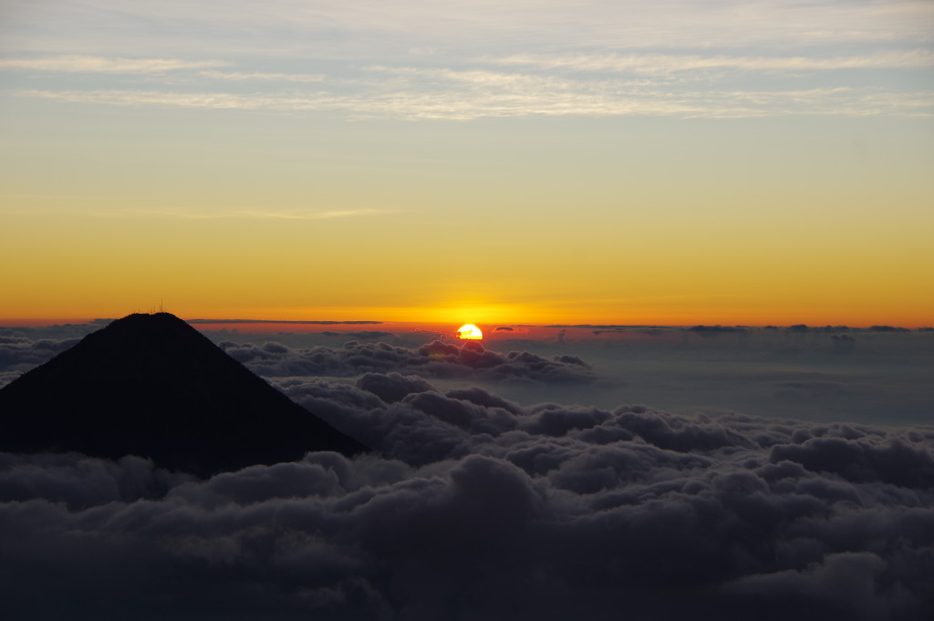 Sunrise on Acatenango, with Fuego rising out of the clouds